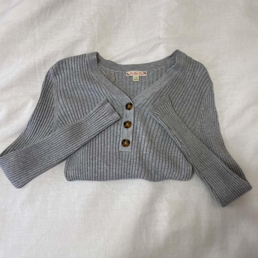 grey button-up sweater
